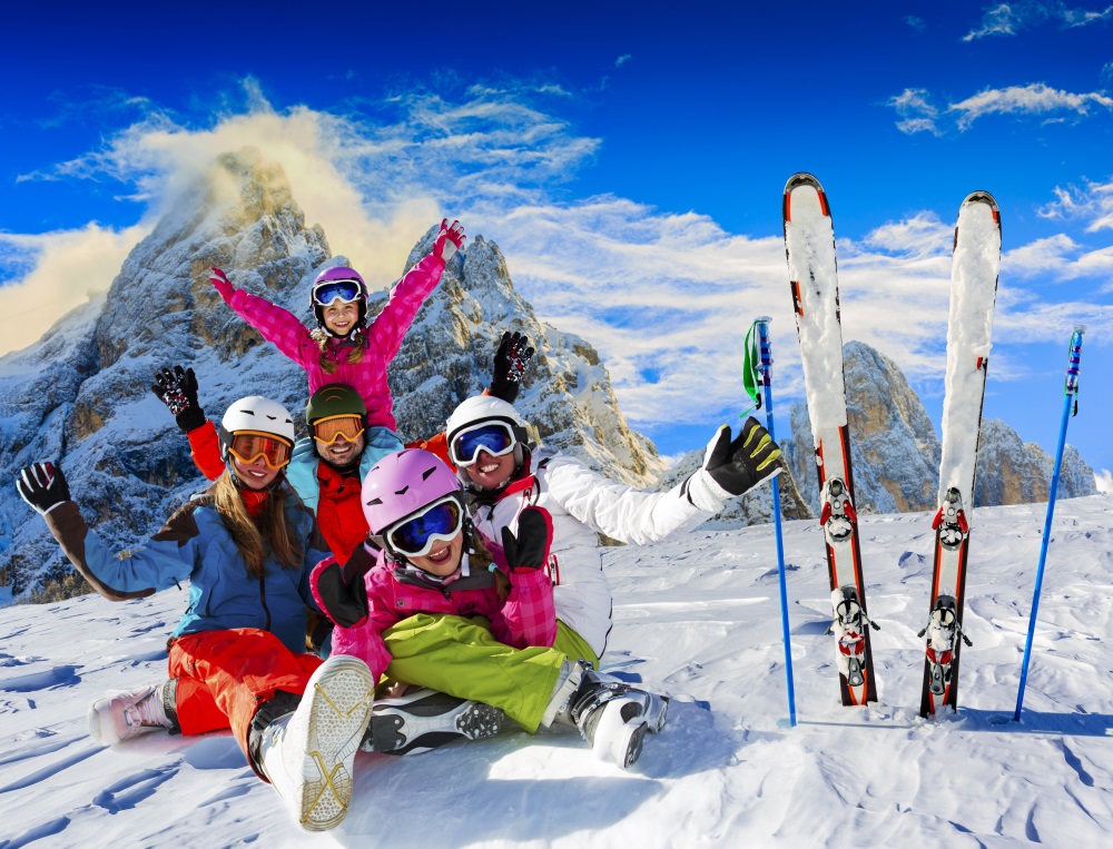 Skiing family enjoying winter vacation on snow in sunny cold day in mountains and fun. San Martino di Castrozza, Italy_662681575.jpg